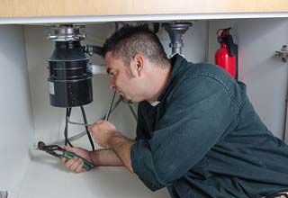 Larry is in the middle of a Corte Madera garbage disposal repair